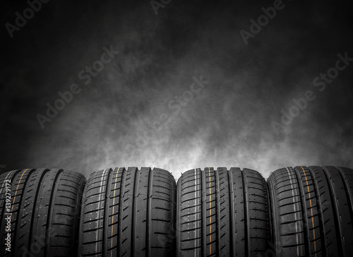Car tires on a dark background. photo