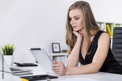 Portrait of businesswoman with a tablet