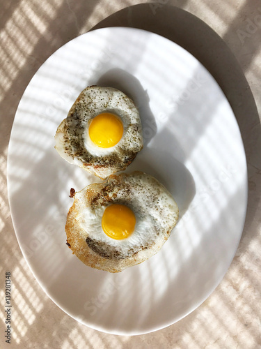 Fried quail egg on a plate.