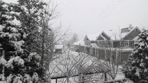 Looking at Winter Snow Fall from House Window