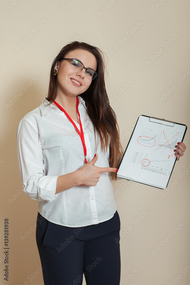 Young female bookkeeper shows accounting documents Young female bookkeeper shows accounting documents