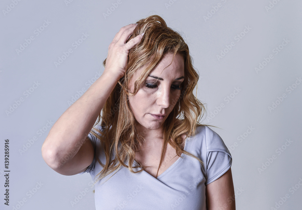 blond attractive woman on her thirties sad and depressed looking desperate in sorrow blond attractive woman on her thirties sad and depressed looking desperate in sorrow