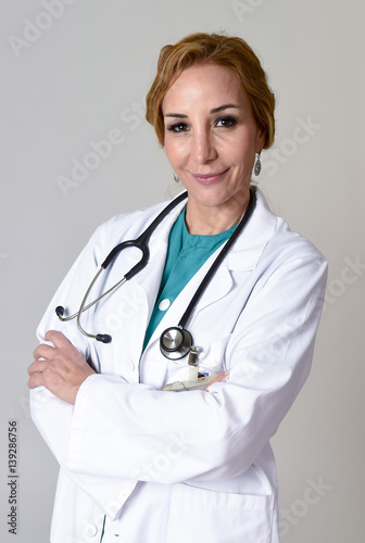 beautiful and happy woman md doctor or nurse posing smiling cheerful with stethoscope