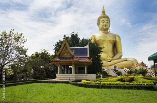 Thai people and travelers foreigner visit and pray golden biggest Shakyamuni buddha statue at Wat Muang temple