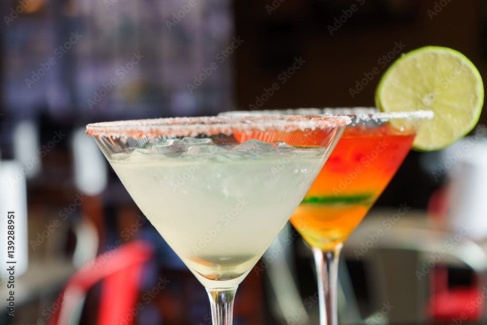 I count on some cocktails in a bar on a marble table on a black restaurant background. I count on some cocktails in a bar on a marble table on a black restaurant background.