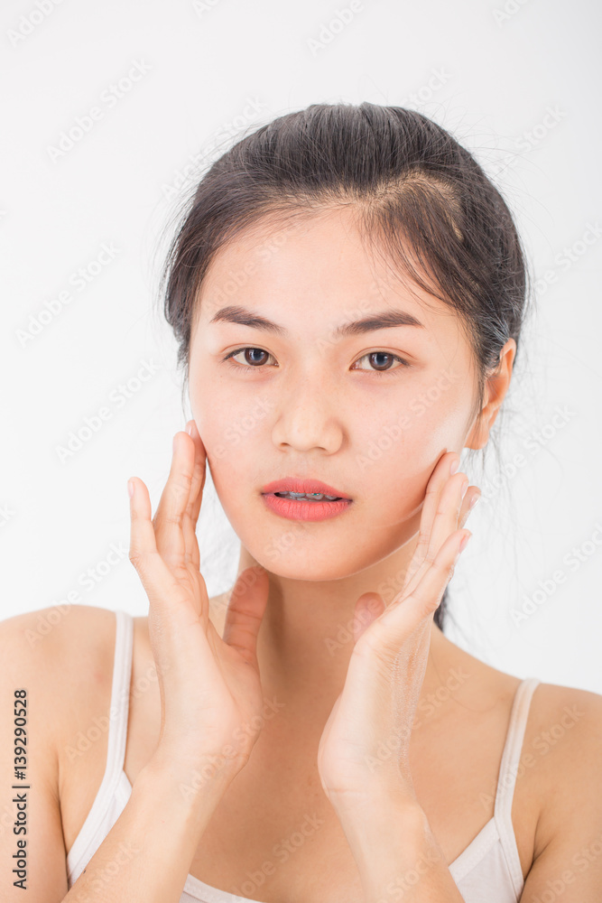 asian woman massage her face and apply cream cosmetic asian woman massage her face and apply cream cosmetic