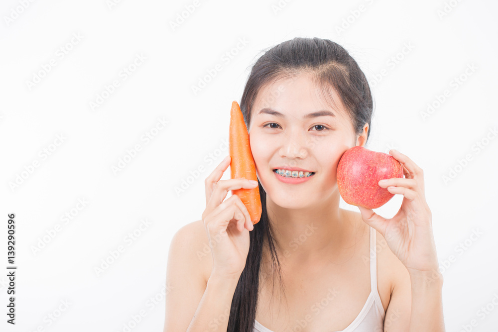 Healthy young beautiful woman holding carrot and apple Healthy young beautiful woman holding carrot and apple
