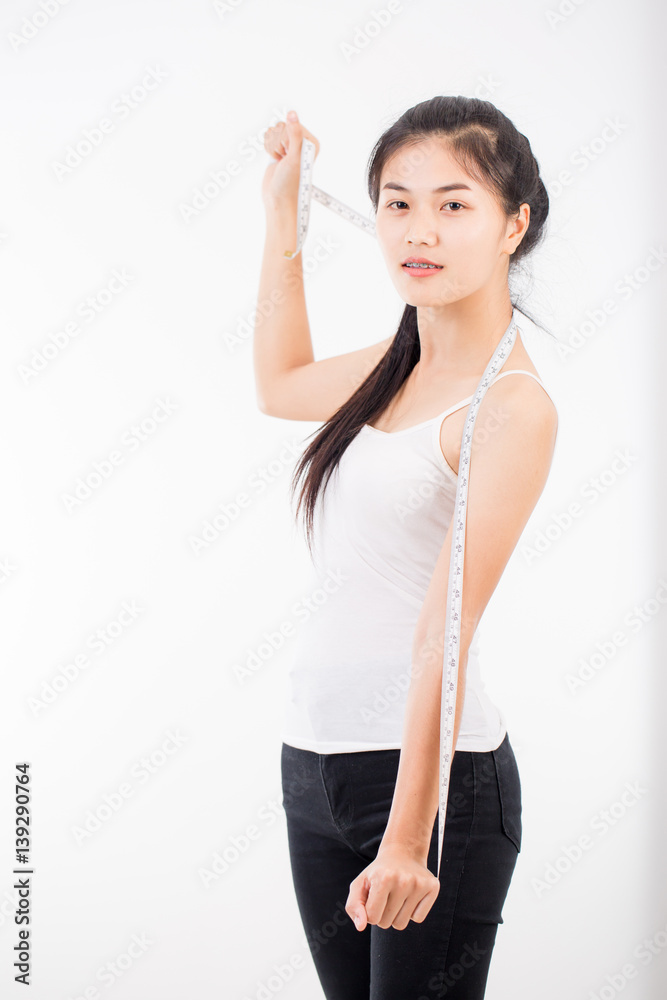sport and heath concept - beautiful sporty woman with measuring tape sport and heath concept - beautiful sporty woman with measuring tape