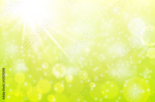 Abstract spring background with sun beams and blurred bokeh