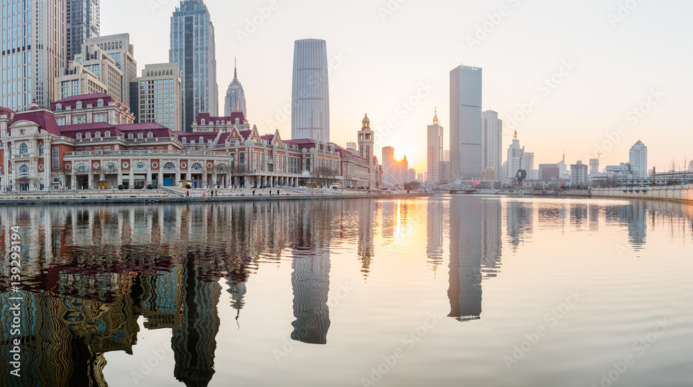 Naklejka premium River And Modern Buildings Against Sky in Tianjin,China.