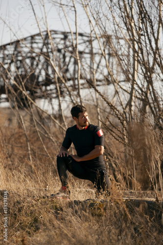 Man exercising by the river