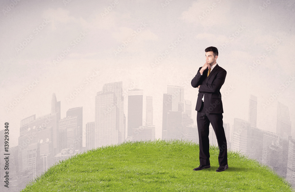 man standing in front of city landscape man standing in front of city landscape