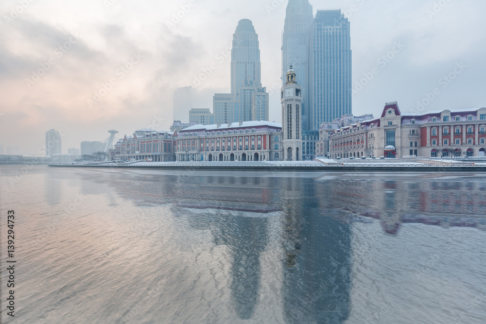 Naklejka premium River And Modern Buildings Against Sky in Tianjin,China.