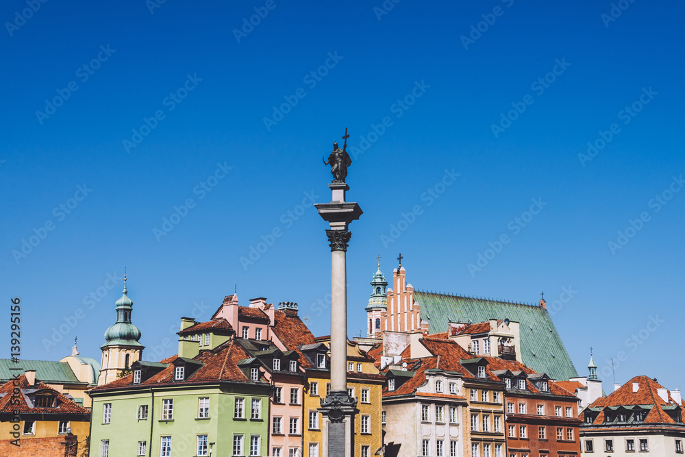 Old historic house roofs, church spires and Sigismund's Column called Kolumna Zygmunta by autumn day.