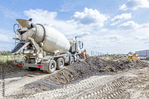 Back side view on concrete mixer, ready for pouring into transporter