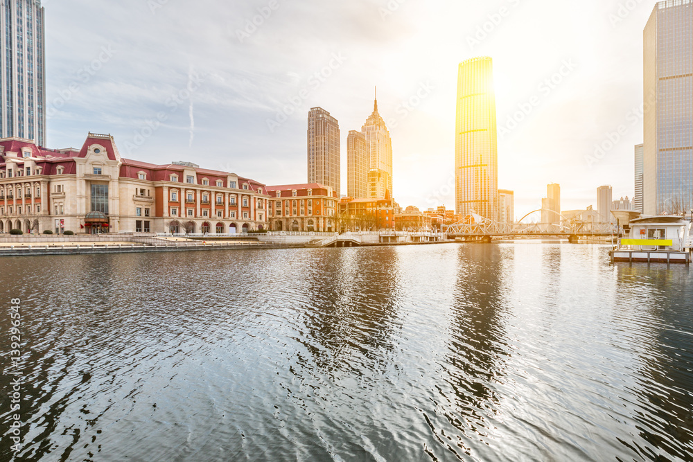 River And Modern Buildings Against Sky in Tianjin,China.