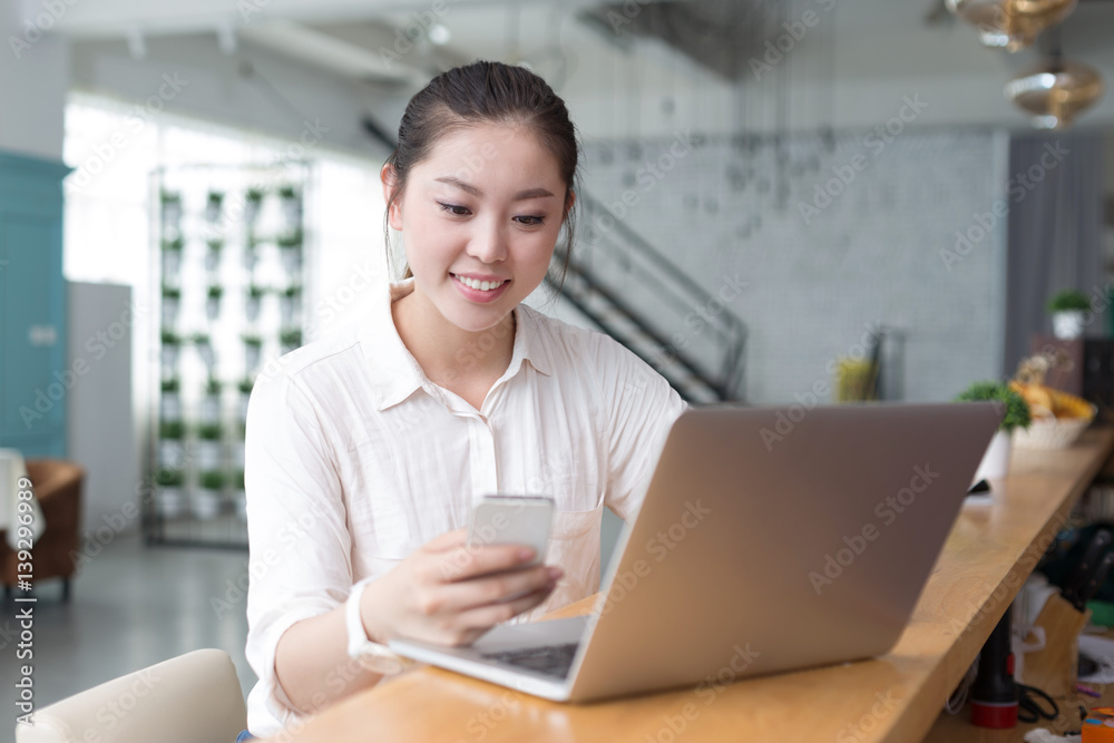 young pretty woman relaxes in office
