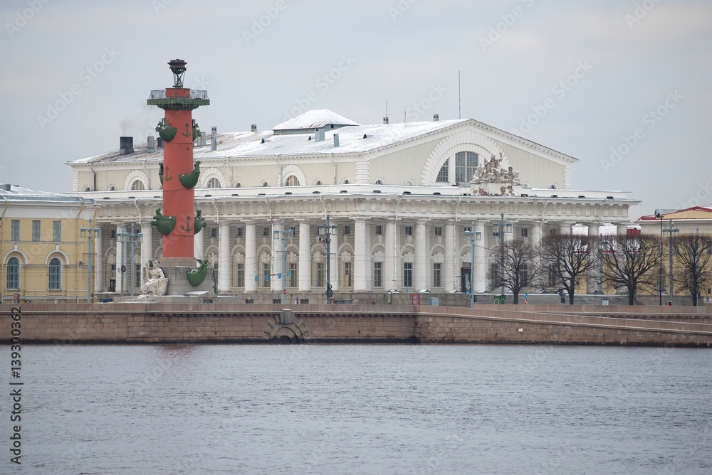 Old South Rostral column and the building of the St. Petersburg stock Exchange on the spit of Vasilyevsky island cloudy December day. Historic centre of Saint Petersburg, Russia