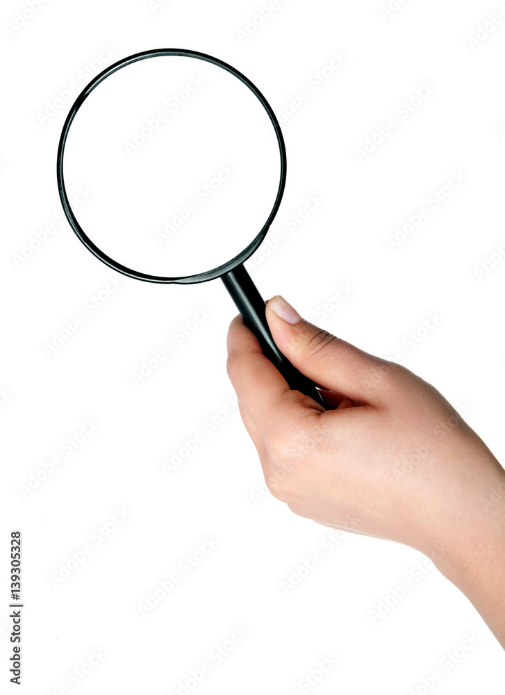Female hand holding the magnifying glass isolated on white background Female hand holding the magnifying glass isolated on white background