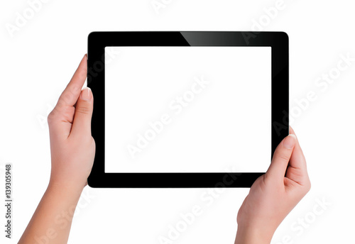 Hand holding a tablet computer with white screen. Woman hands showing empty screen of modern digital tablet. Hand holding tablet pc isolated on white background with blank screen.