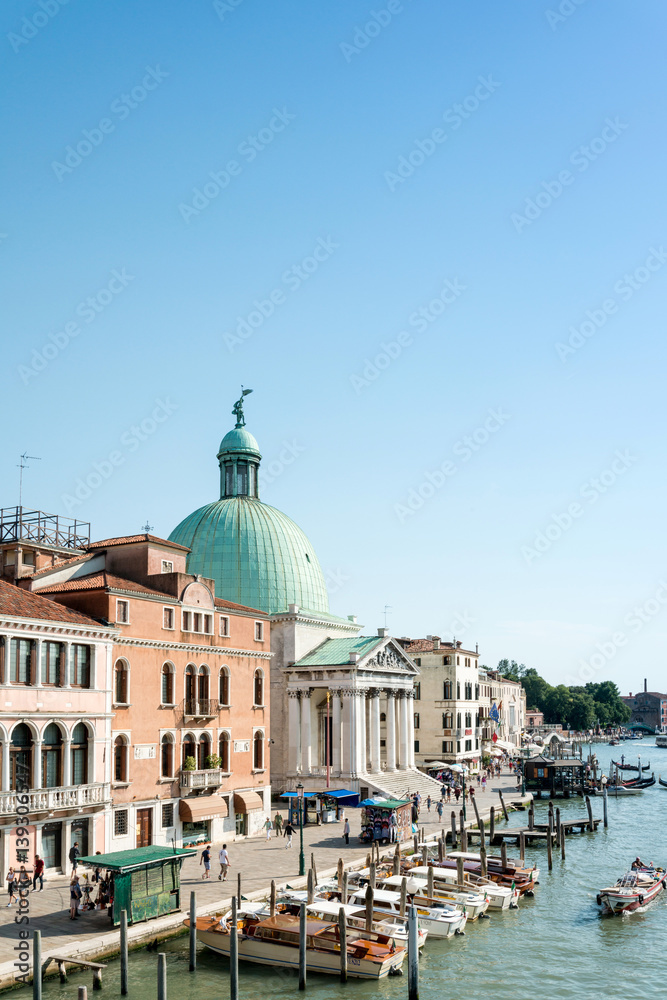 VENICE, ITALY - June 30, 2016.View of water street and old buildings in Venice on June 30, 2016. its entirety is listed as a World Heritage Site, along with its lagoon.June 30 VENICE, ITALY