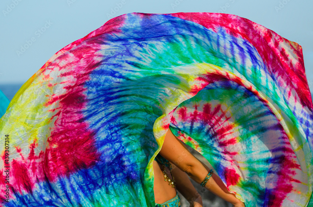 Close up of belly dance silk shawl. Colorful scarf in movement. Belly dancing detail background.