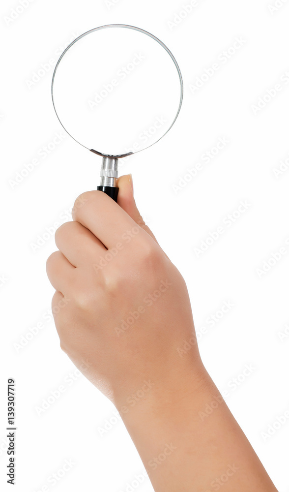 Female hand holding the magnifying glass isolated on white background Female hand holding the magnifying glass isolated on white background