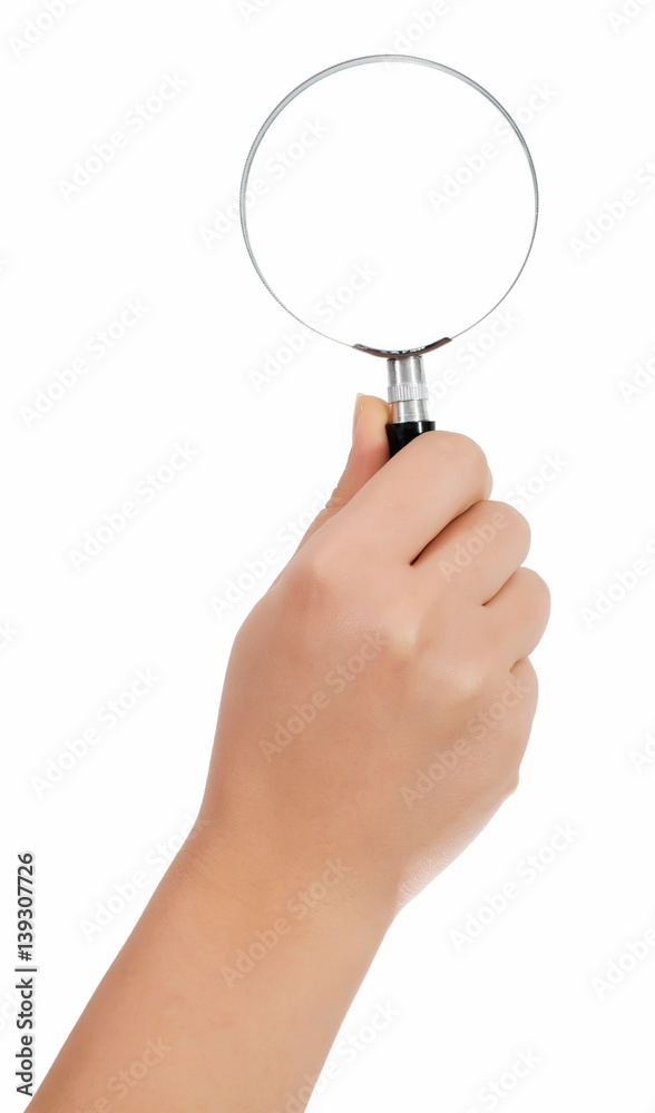 Female hand holding the magnifying glass isolated on white background Female hand holding the magnifying glass isolated on white background