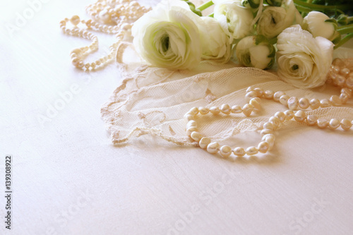 white delicate lace fabric and white flowers