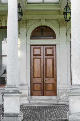 Brown door and columns