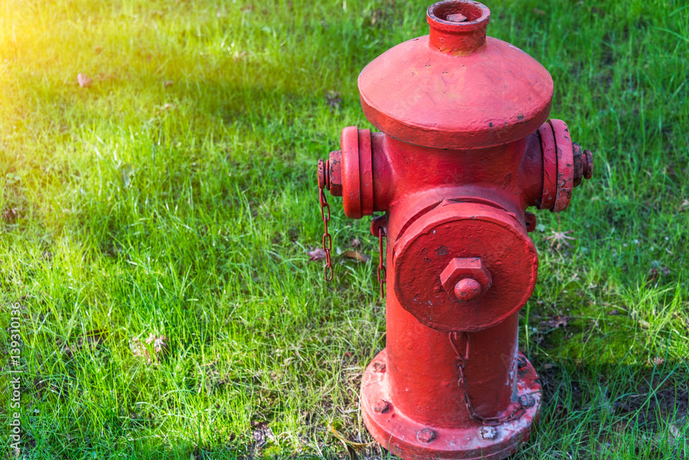 detail shot of fire hydrant on grass in city of China. detail shot of fire hydrant on grass in city of China.