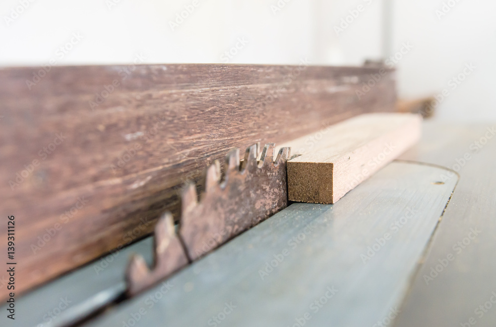 The carpenter was working furniture wood in studio , Soft-focus image The carpenter was working furniture wood in studio , Soft-focus image