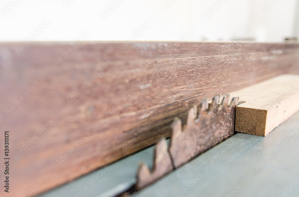 The carpenter was working furniture wood in studio , Soft-focus image The carpenter was working furniture wood in studio , Soft-focus image