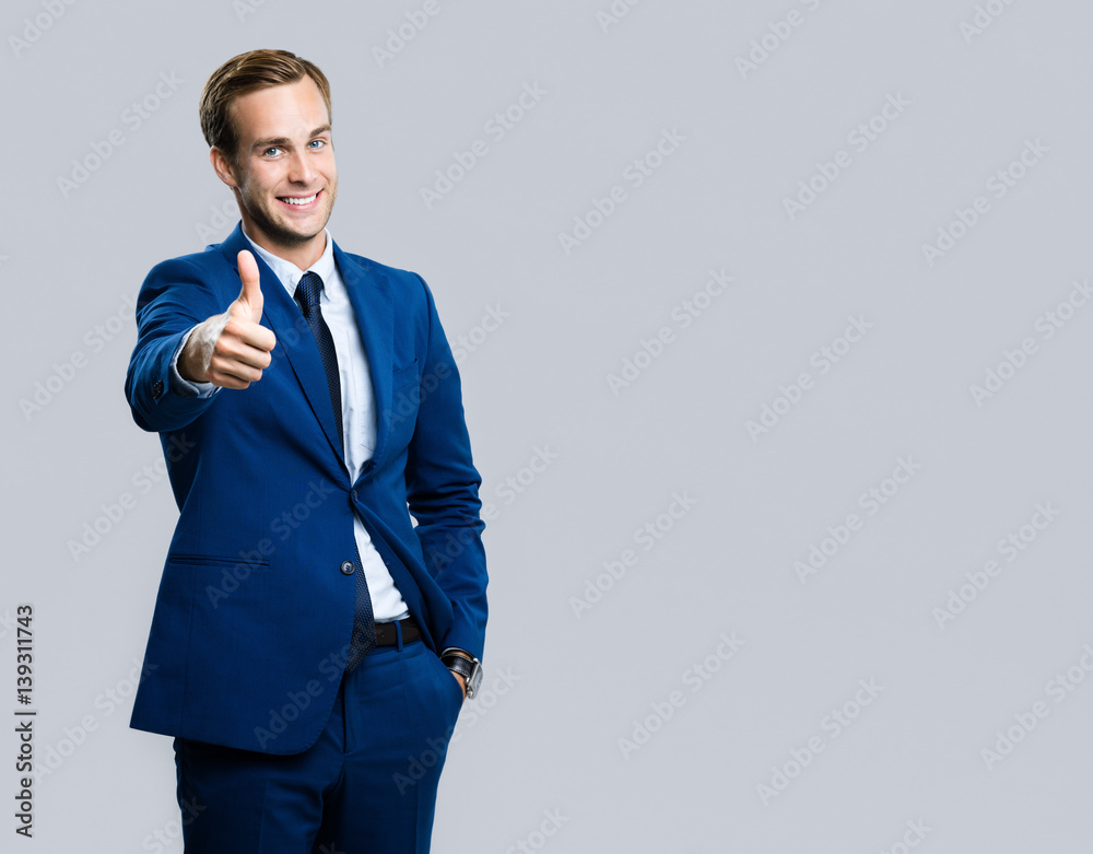 businessman with thumbs up gesture businessman with thumbs up gesture