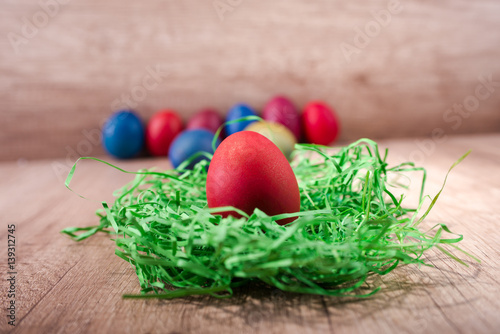 Happy Easter, red egg in a nest