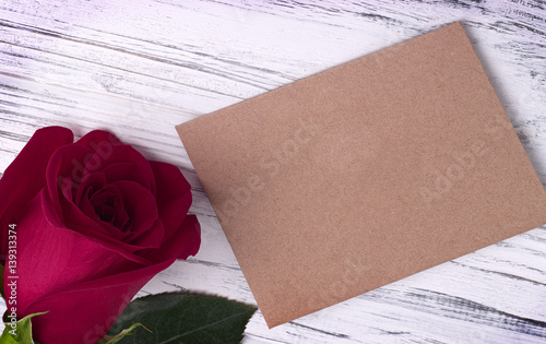 red rose and and envelope for valentines day womens day greeting card. photo