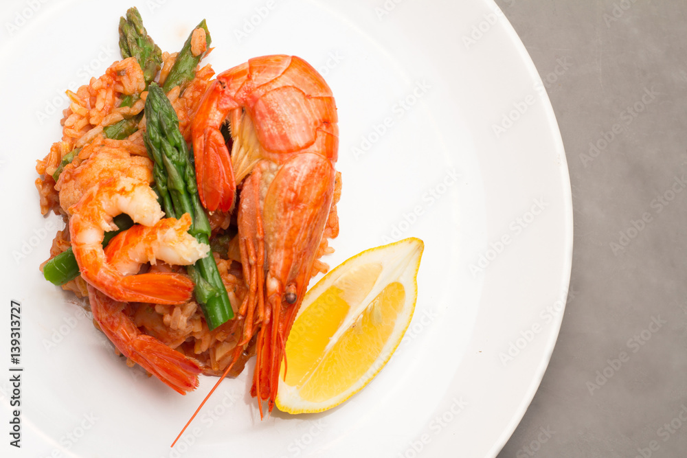 rice with shrimp and asparagus in a tomato sauce. rice with shrimp and asparagus in a tomato sauce.