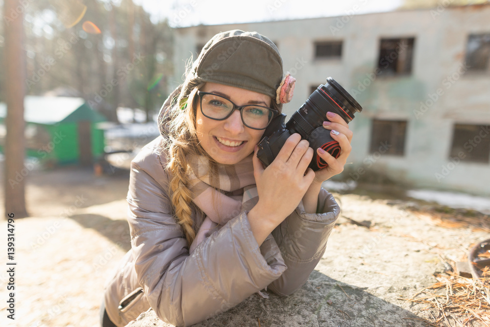 girl in sunglasses with a camera in nature. girl in sunglasses with a camera in nature.