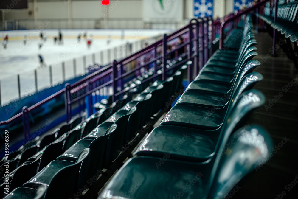 Naklejka premium Plastic seat spectator stands for the ice hockey stadium 