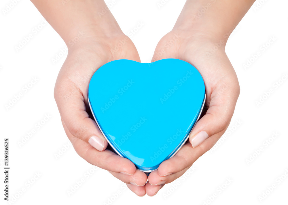 Obraz premium hands holding sweet little heart isolated on white background.