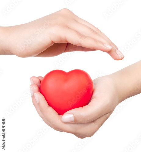 hands holding sweet little heart isolated on white background.