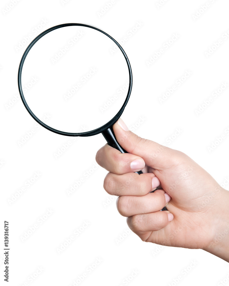 Female hand holding the magnifying glass isolated on white background Female hand holding the magnifying glass isolated on white background