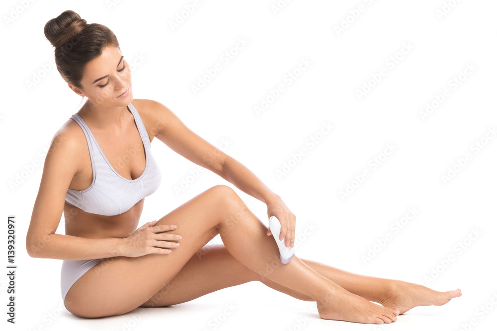Fototapeta premium Beautiful woman with epilator