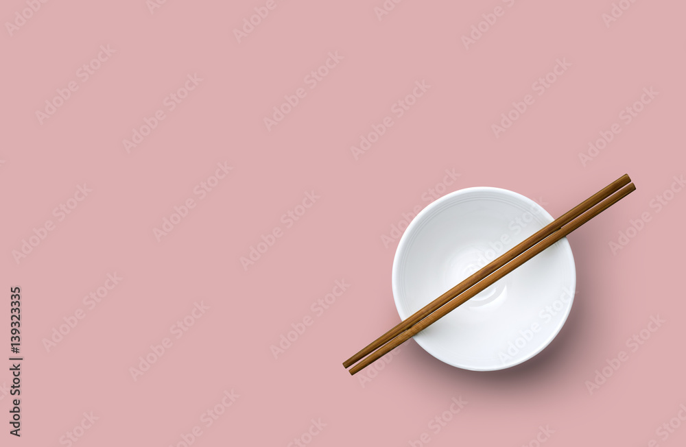 Top view of chopsticks with bowl on pink background. Top view of chopsticks with bowl on pink background.