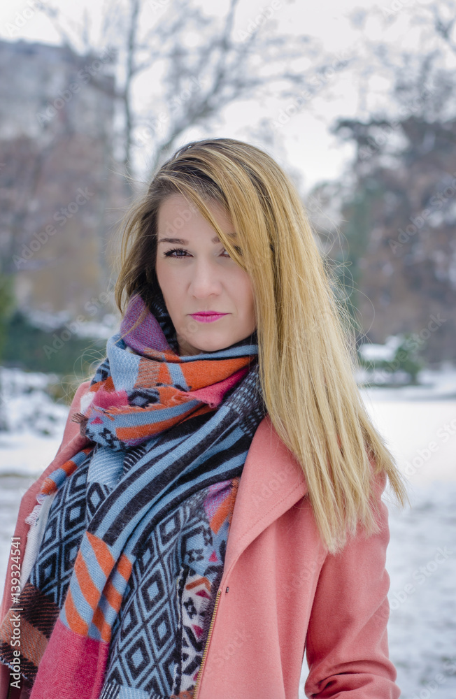 Wintertime. Woman in park at wintertime. Wintertime. Woman in park at wintertime.