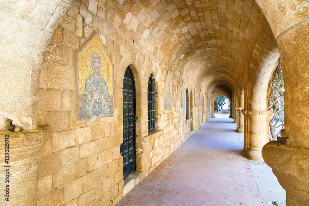 Interior of Filerimos monastery with copy of icon on the walls