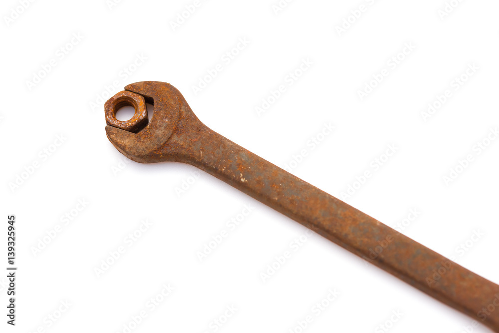 rusty nut and spanner on a white background rusty nut and spanner on a white background