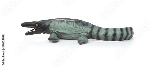 side view Mosasaurus toy with shadow on white background