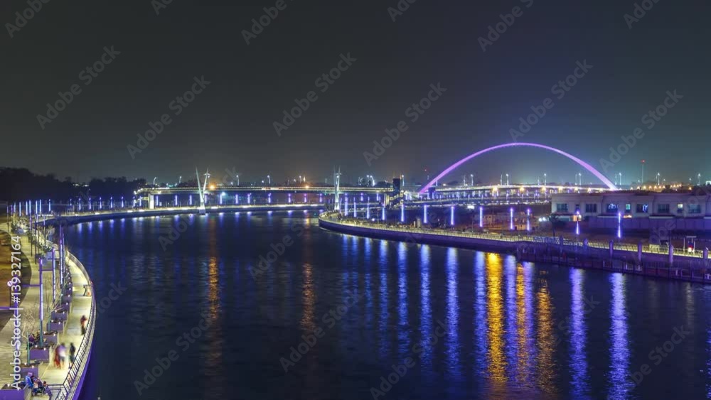 Two bridges over newly opened Dubai canal with a boat crossing under them timelapse. Two bridges over newly opened Dubai canal with a boat crossing under them timelapse.