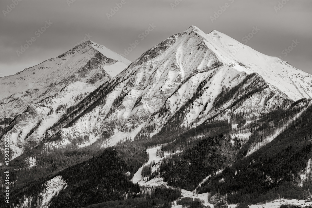 The mountain peaks of La Grande and Petite Autane covered in snow in winter. Black & White. Ecrins National Parc, Champsaur, Hautes Alpes, French Alps. France